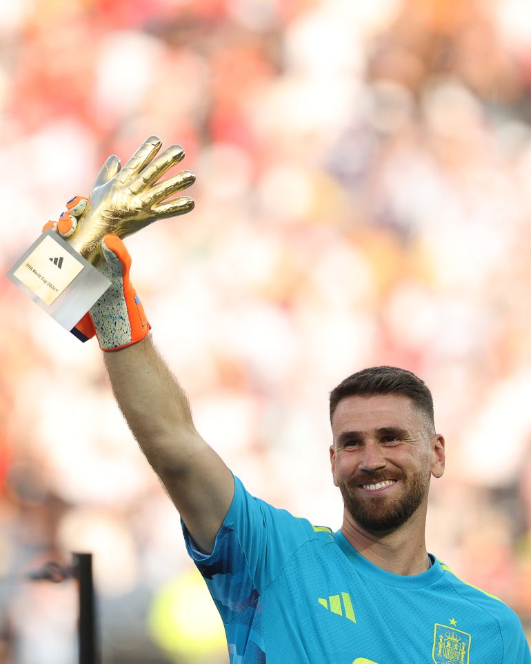 Spain's goalkeeper #23 Unai Simon receives the Golden Glove Award during the award ceremony of the 2026 World Cup football tournament final match between Spain and Argentina at the New York/New Jersey Stadium in East Rutherford on July 19, 2026.