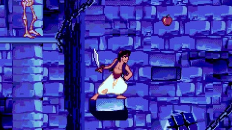 Aladdin holds a scimitar while standing on a small platform in Aladdin