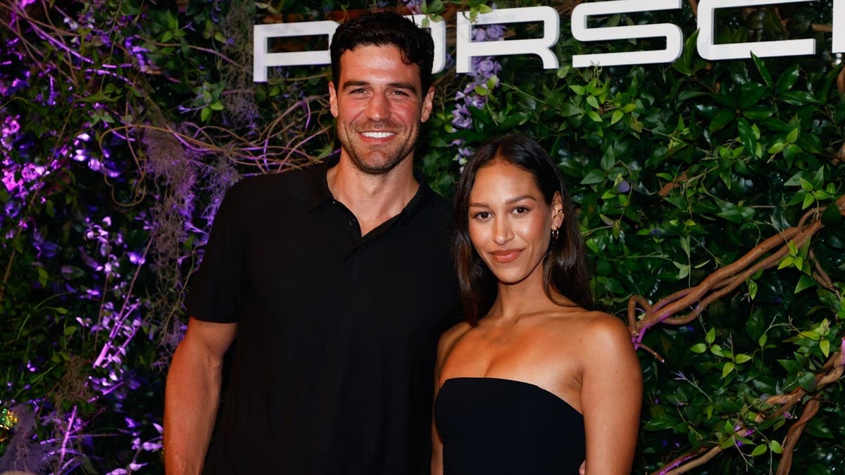 Joe Amabile and Serena Pitt stand at a party in New York.