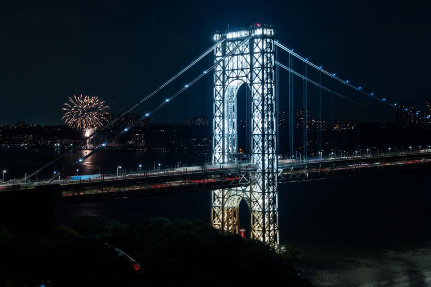 The George Washington Bridge's two towers are lit ahead of America's 250th birthday, Monday, June 29, 2026, in New York. (AP Photo/Adam Gray)