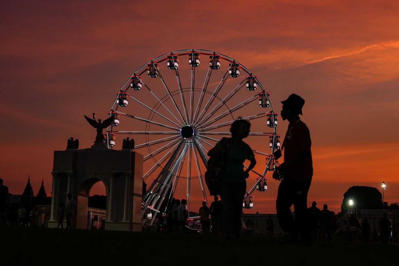 People ride the ferris wheel at the Great American State Fair on the National Mall on June 30, Washington, DC.
