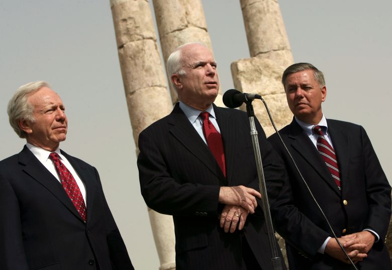 Sen. Joe Lieberman, left, and Graham, right, look on as Sen. John McCain speaks to reporters in Amman, Jordan, on March 18, 2008.