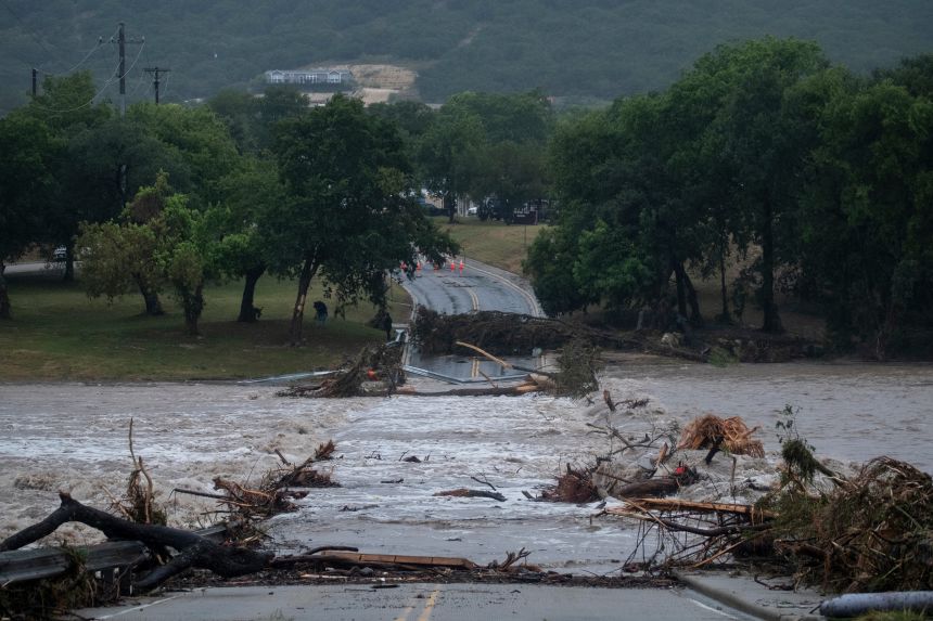 Flooding blocks off G Street along the Guadalupe River on Thursday in Kerrville, Texas.