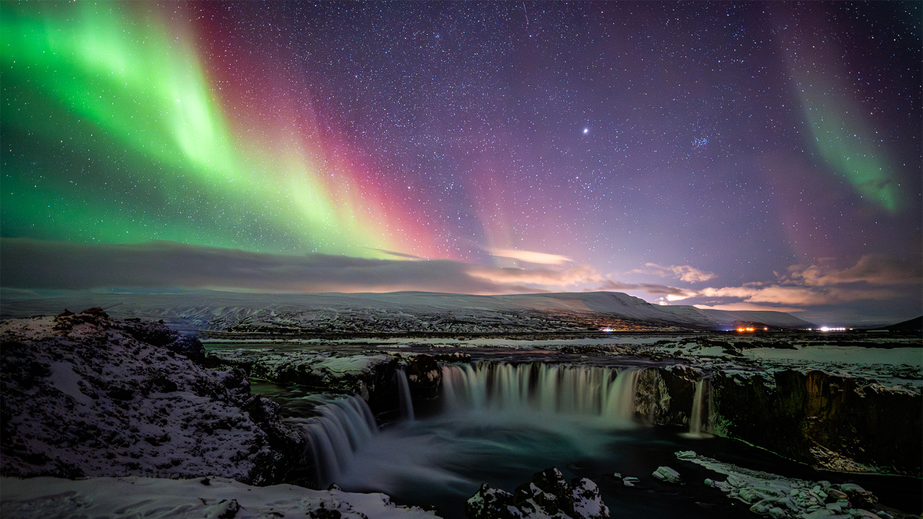 Best Newcomer. Colourful Aurora and Waterfall © Yifan Cao (China). Yifan Cao witnessed a major aurora outburst in Iceland, during which the whole sky shone green, red and purple. Goðafoss Waterfall is a famous scenic spot that is strongly linked to Norse mythology. Taken with a Nikon Z 6III camera, 16 mm f/2.2, ISO 4000, 6-second exposure Location: Goðafoss Waterfall, Þingeyjarsveit, Iceland, 27 February 2025