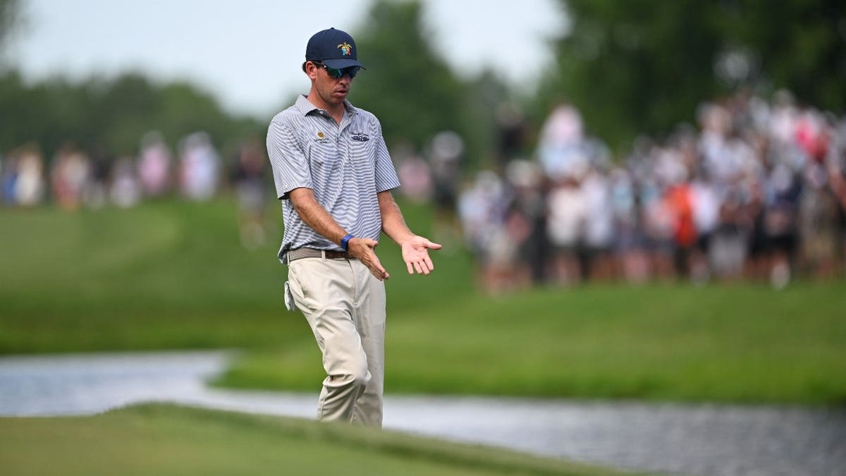 Ben Kohles reacts to hitting his ball into a water hazard on the final round of the 2026 John Deere Classic.