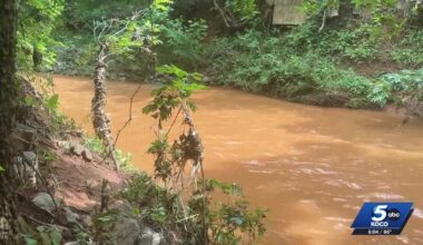 Moore creek flood traps 2 boys in rushing water