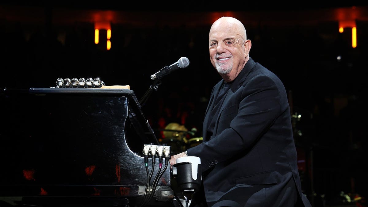 Billy Joel performs on stage at Madison Square Garden.