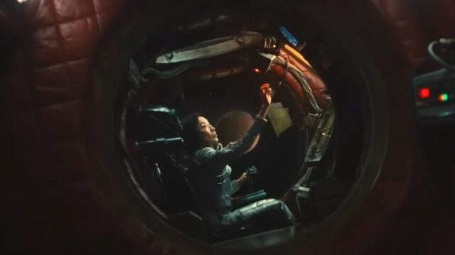 woman in cockpit of a small futuristic aircraft