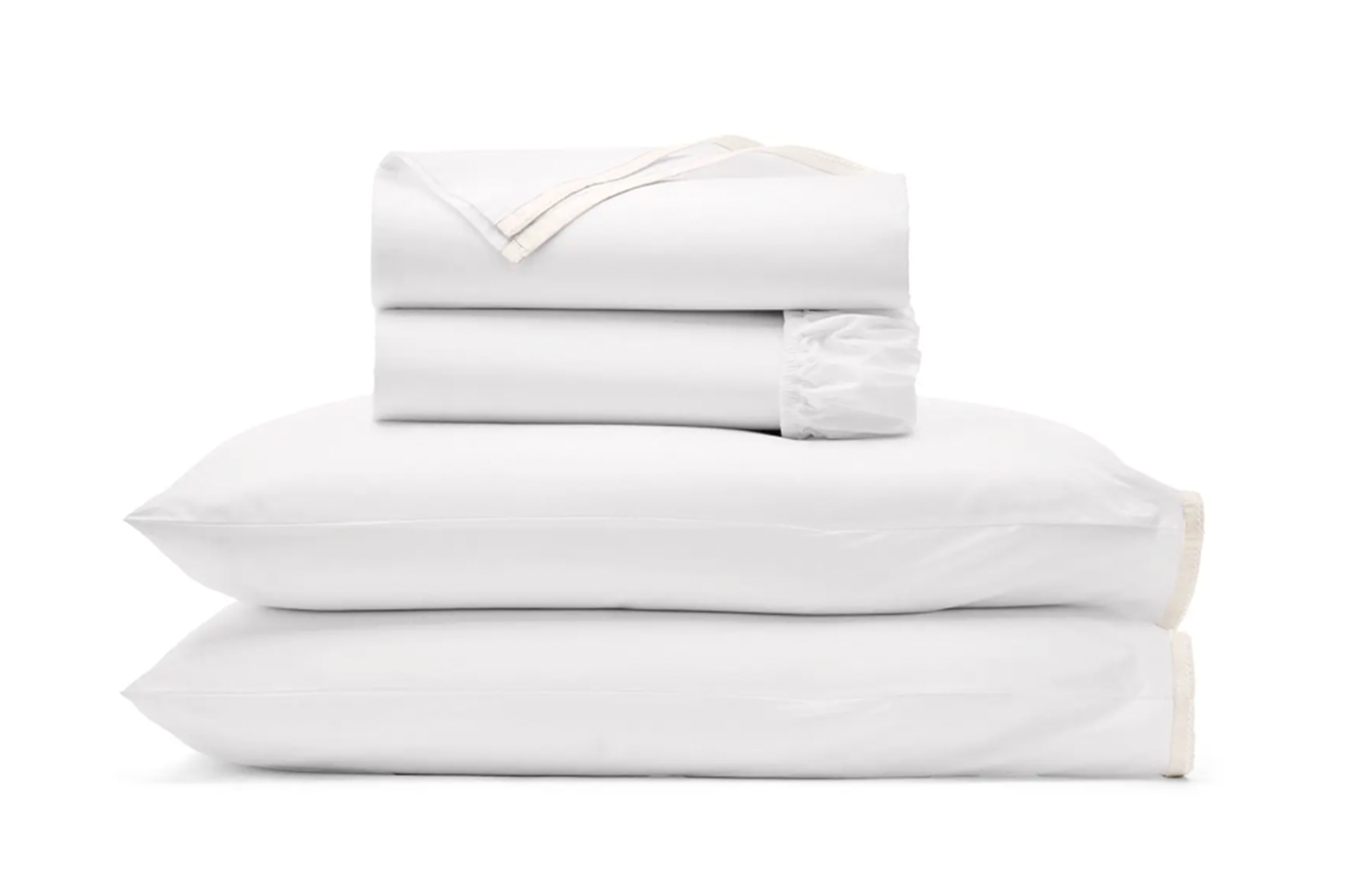 Stack of white sheets and pillowcases with a light tan trim.