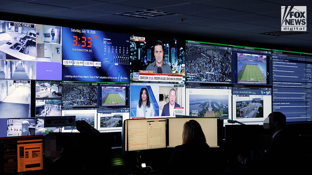 A room within the FBI headquarters showing Fox News playing on the screen.
