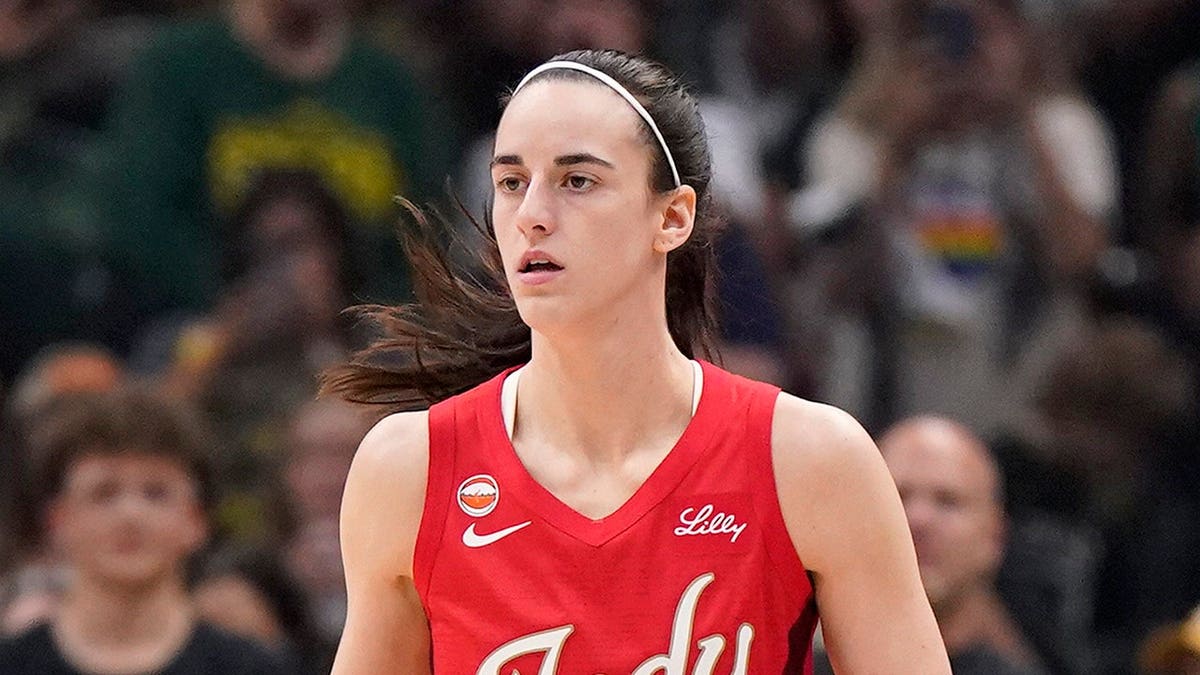 Caitlin Clark dribbles the ball during an Indiana Fever game against the Seattle Storm.