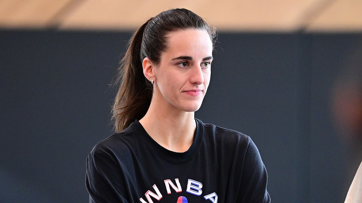 Caitlin Clark, No. 22 of Team Spoon, looks on during WNBA All-Star Practice.