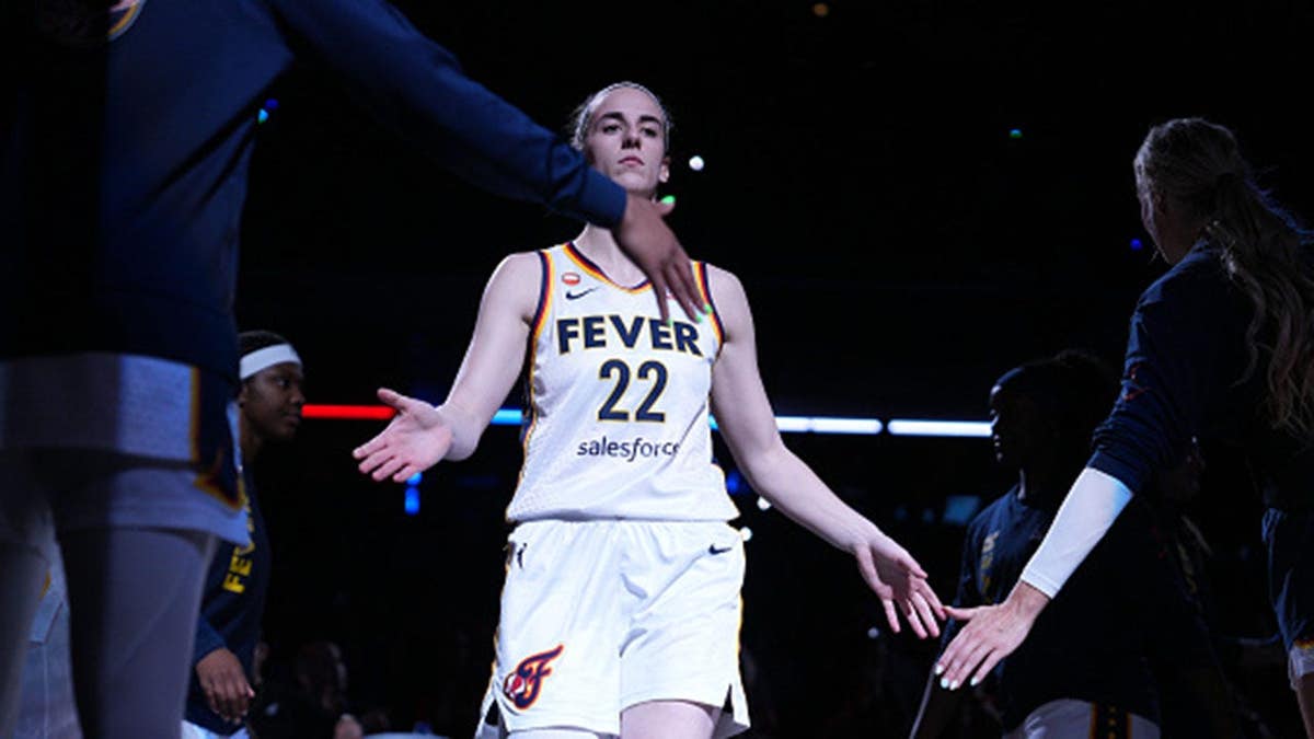 Caitlin Clark stands before the game at Gainbridge Fieldhouse in Indianapolis.