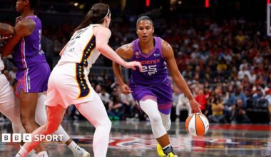 Phoenix Mercury forward Alyssa Thomas drives towards the basket while defended by Indiana Fever guard Caitlin Clark