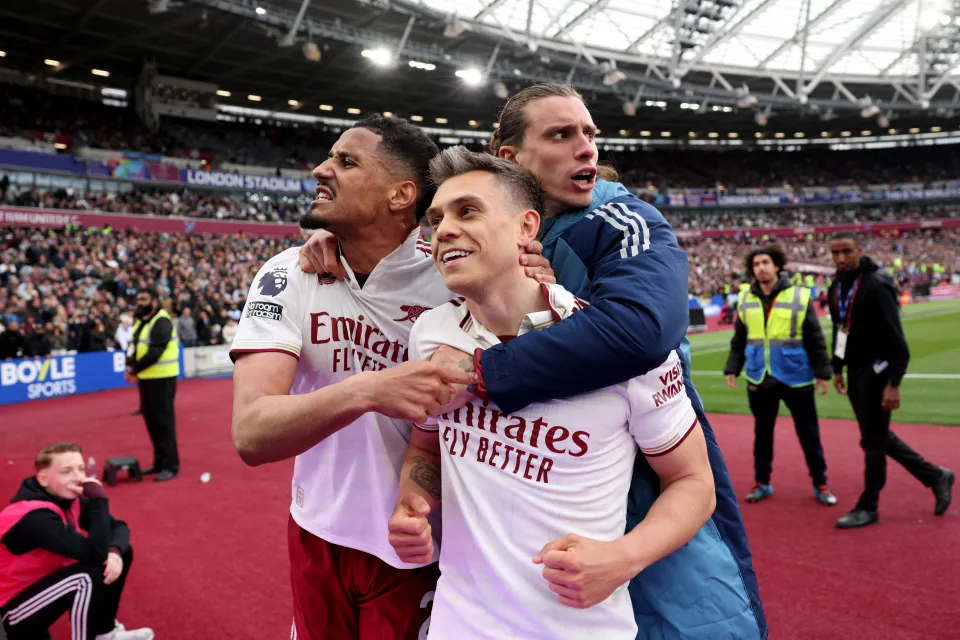 Leandro Trossard (C) celebrates scoring the team's first goal during the English Premier League football match between West Ham United and Arsenal