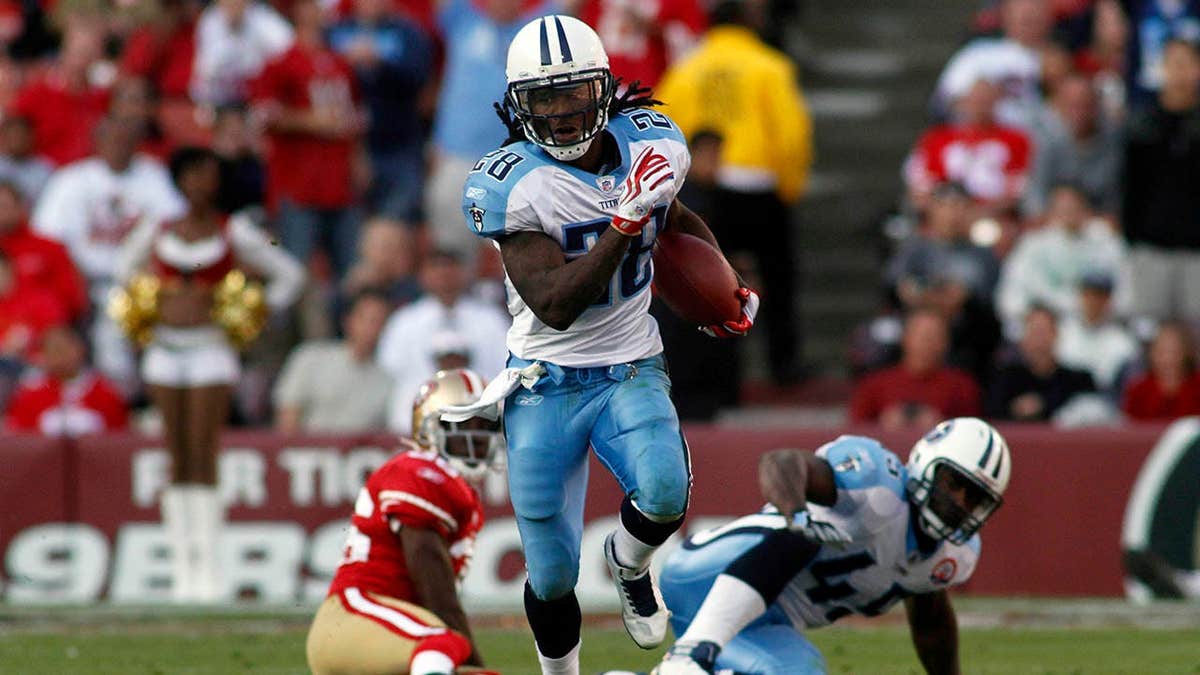 Chris Johnson running with football during NFL game at Candlestick Park