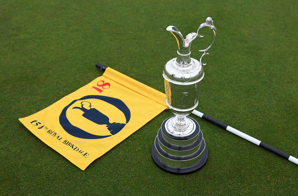 The Claret Jug alongside a pin flag at Royal Birkdale ahead of The Open in 2026.