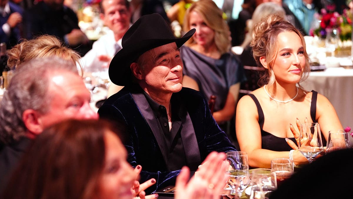 Clint Black and Lily Pearl Black seated at the 2025 BMI Country Awards in Nashville.