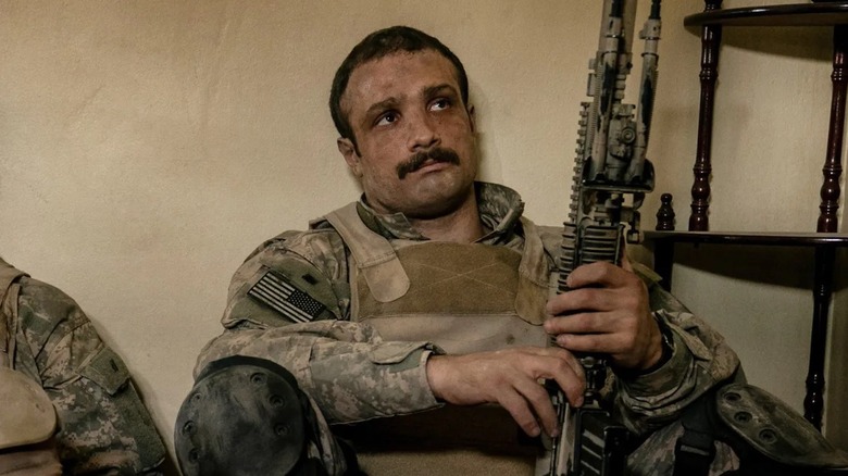 Cosmo Jarvis is hunkered down with a machine gun as Elliott Miller in Warfare