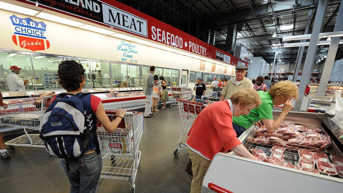 People shop inside a Costco store.