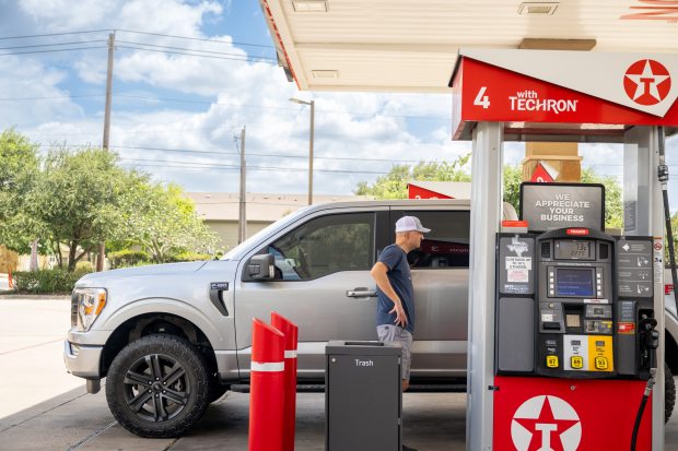 A person pumps gas at a Texaco gas station on July 10, 2026, in Austin, Texas. A recent survey conducted by The Harris Poll found that groceries and gasoline top the list of goods Americans are struggling to afford. (Brandon Bell/Getty)