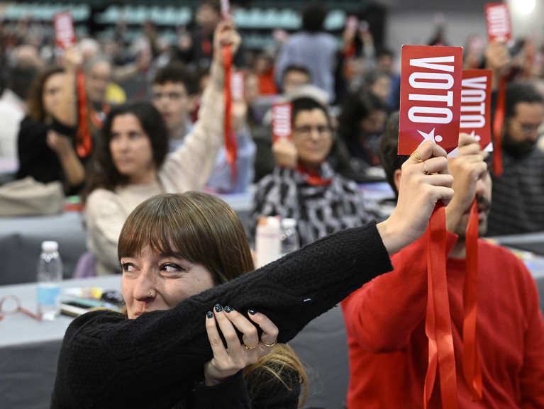 Members of the Bloco de Esquerda hold cards up during an election for new leadership at their 14th National Convention in Portugal.