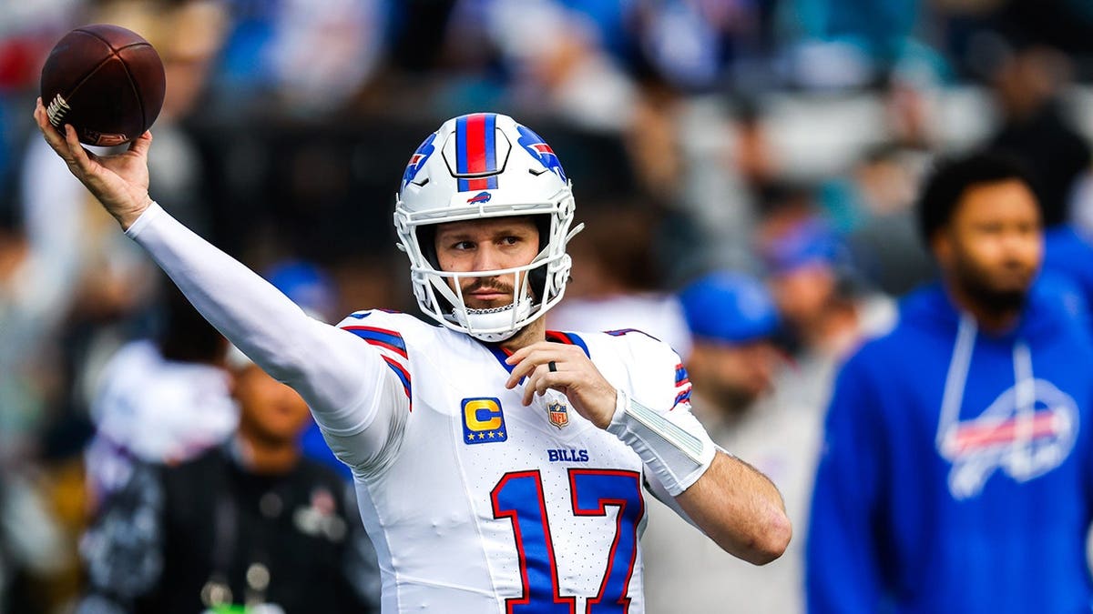 Josh Allen warms up before the first quarter of a game