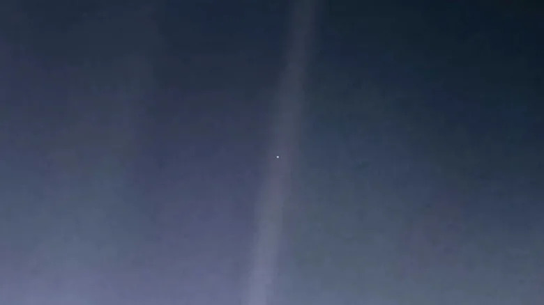 The Pale Blue Dot, an iconic photograph of Earth captured by Voyager 1 spacecraft in 1990.
