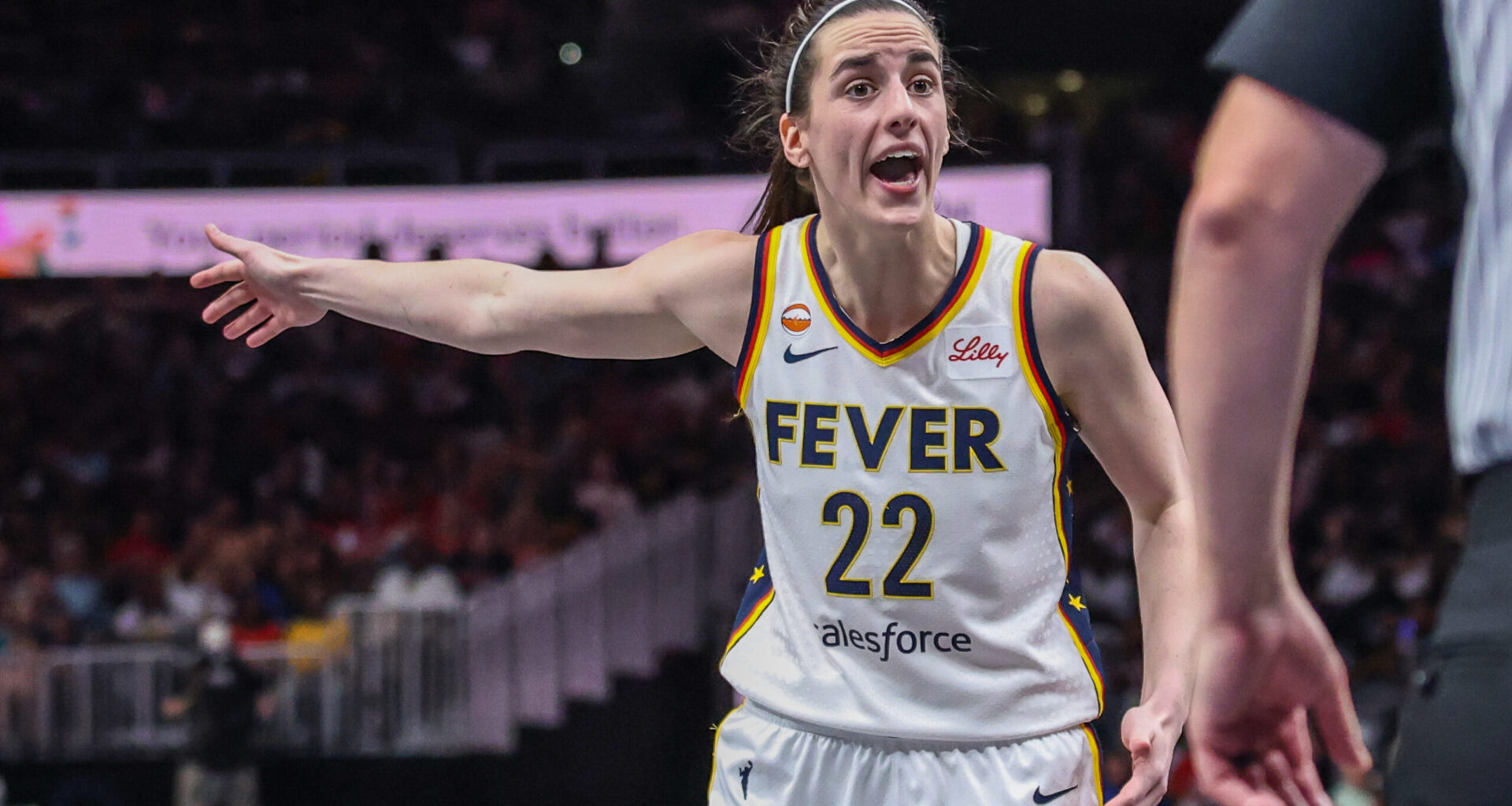 Indiana Fever guard Caitlin Clark (22) yells at the referee after a call at State Farm Arena