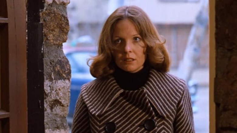 Diane Keaton as a glaring Kay Adams-Corleone stands at the threshold of her home in The Godfather