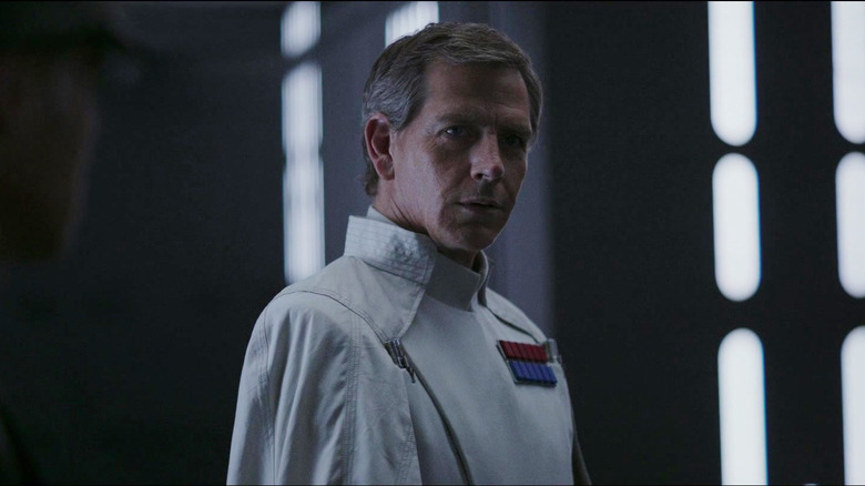 Ben Mendelsohn as Director Krennic, standing aboard the Death Star, in Rogue One: A Star Wars Story.