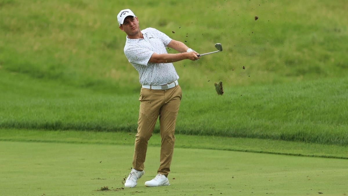 Emiliano Grillo swings from the fairway during the 3M Open golf tournament.