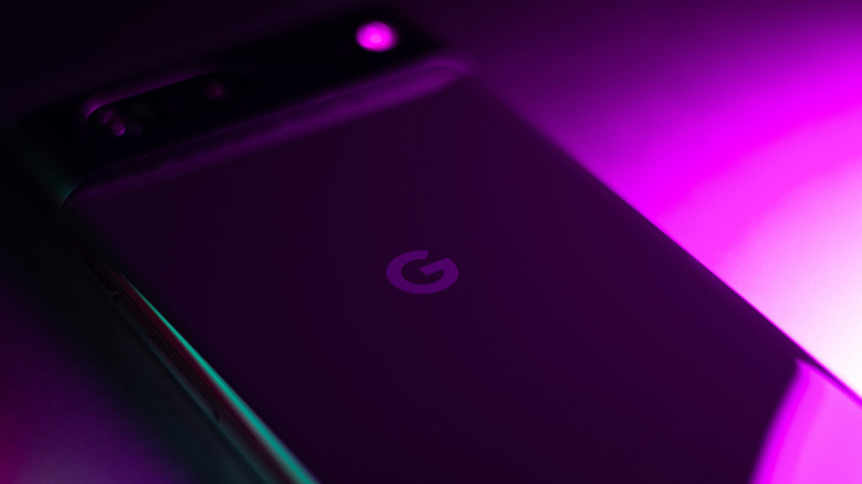 Pixel Phone pictured under neon lights shining purple
