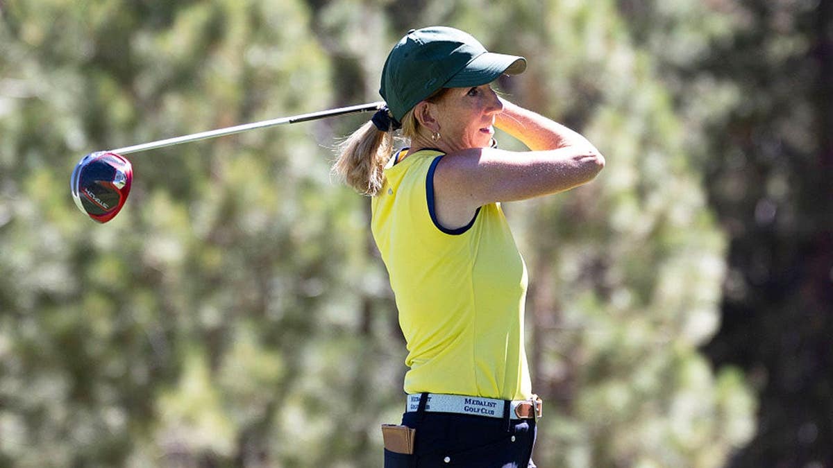 Cathy Engelbert tees off on a golf course in Stateline, Nevada.