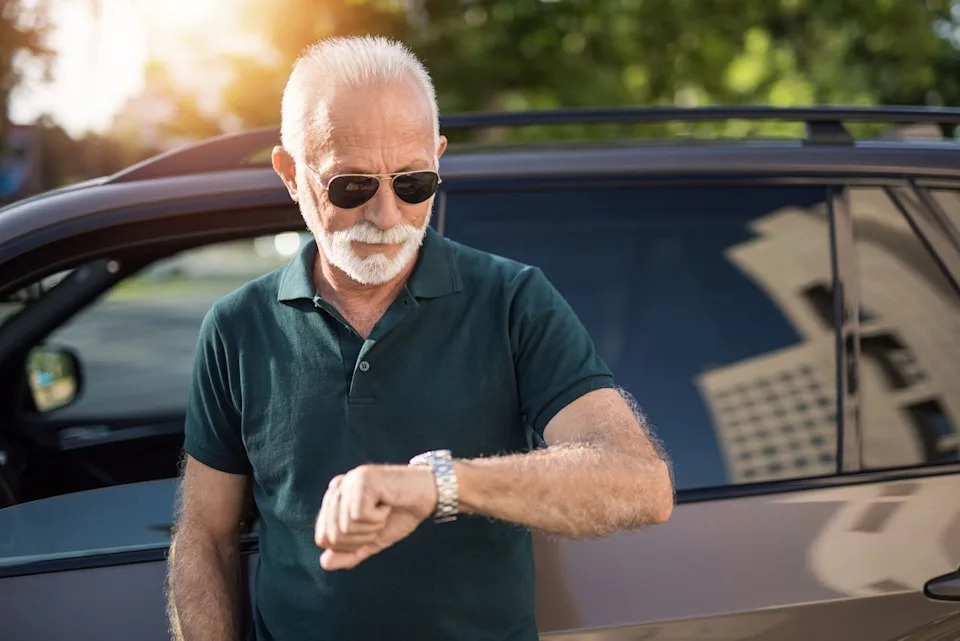 Older adult checking the time.
