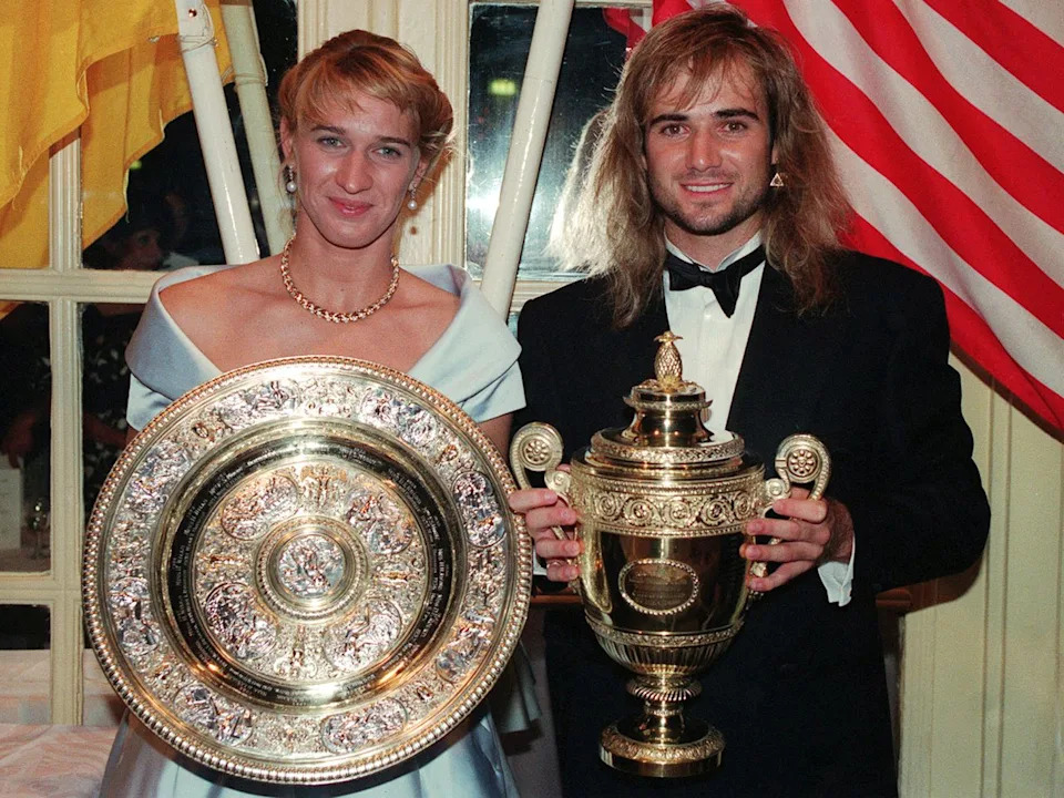 teffi Graf and Andre Agassi with their trophies at the post Wimbledon DinnerCredit: David Giles - PA Images/PA Image/Getty