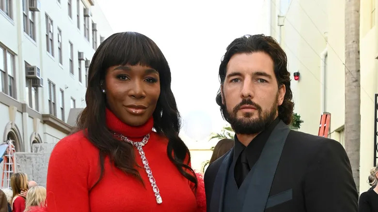 Venus Williams red gown Andrea Preti black suit