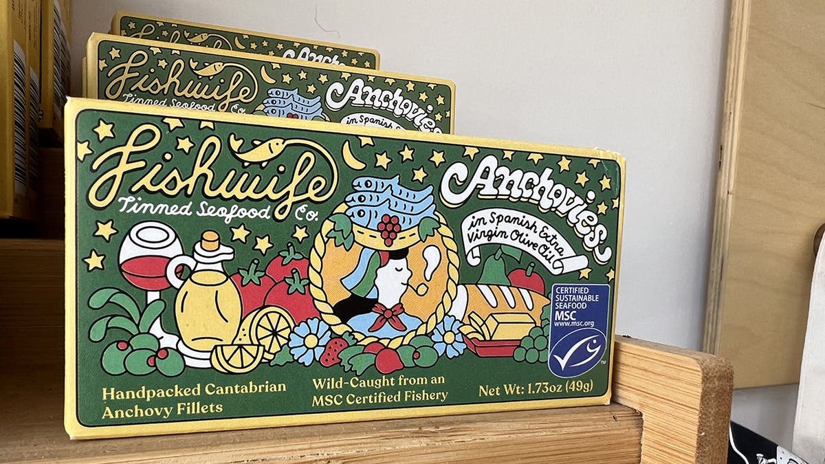 A sign advertising Fishwife anchovies.