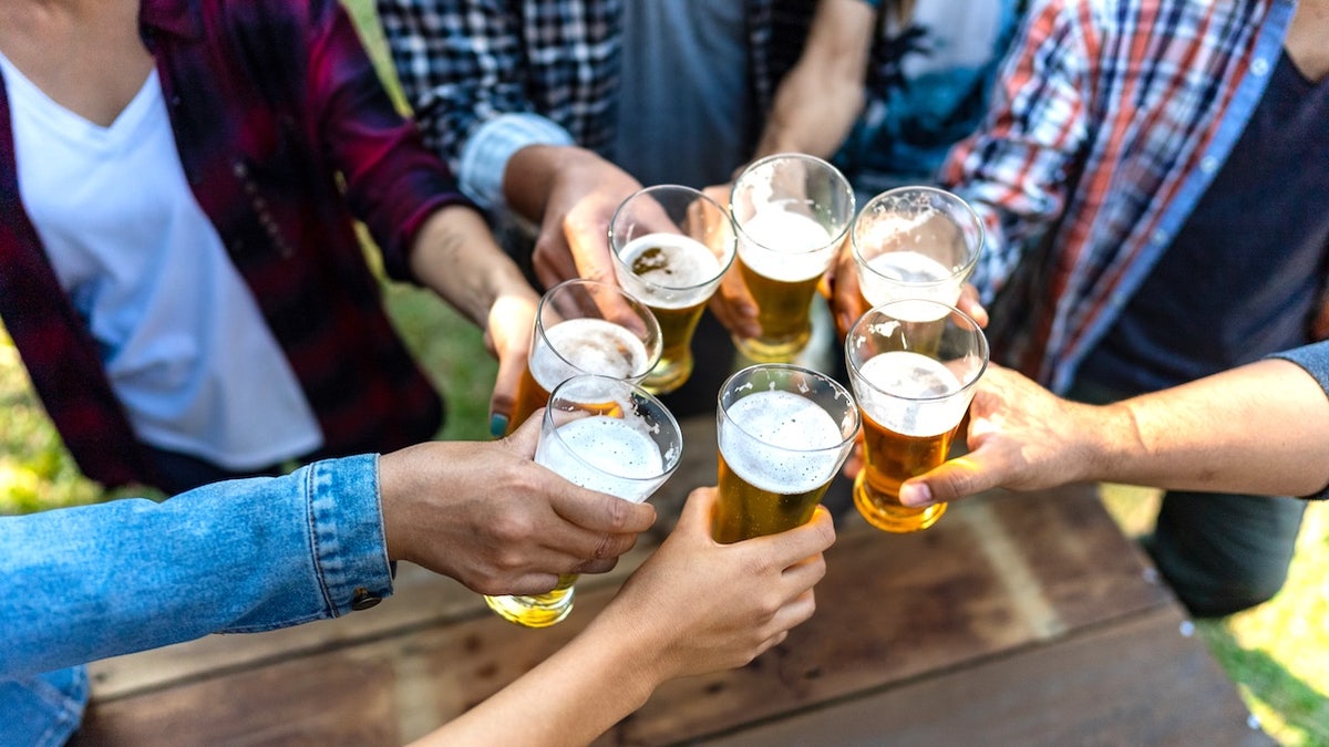 Friends toasting with beer