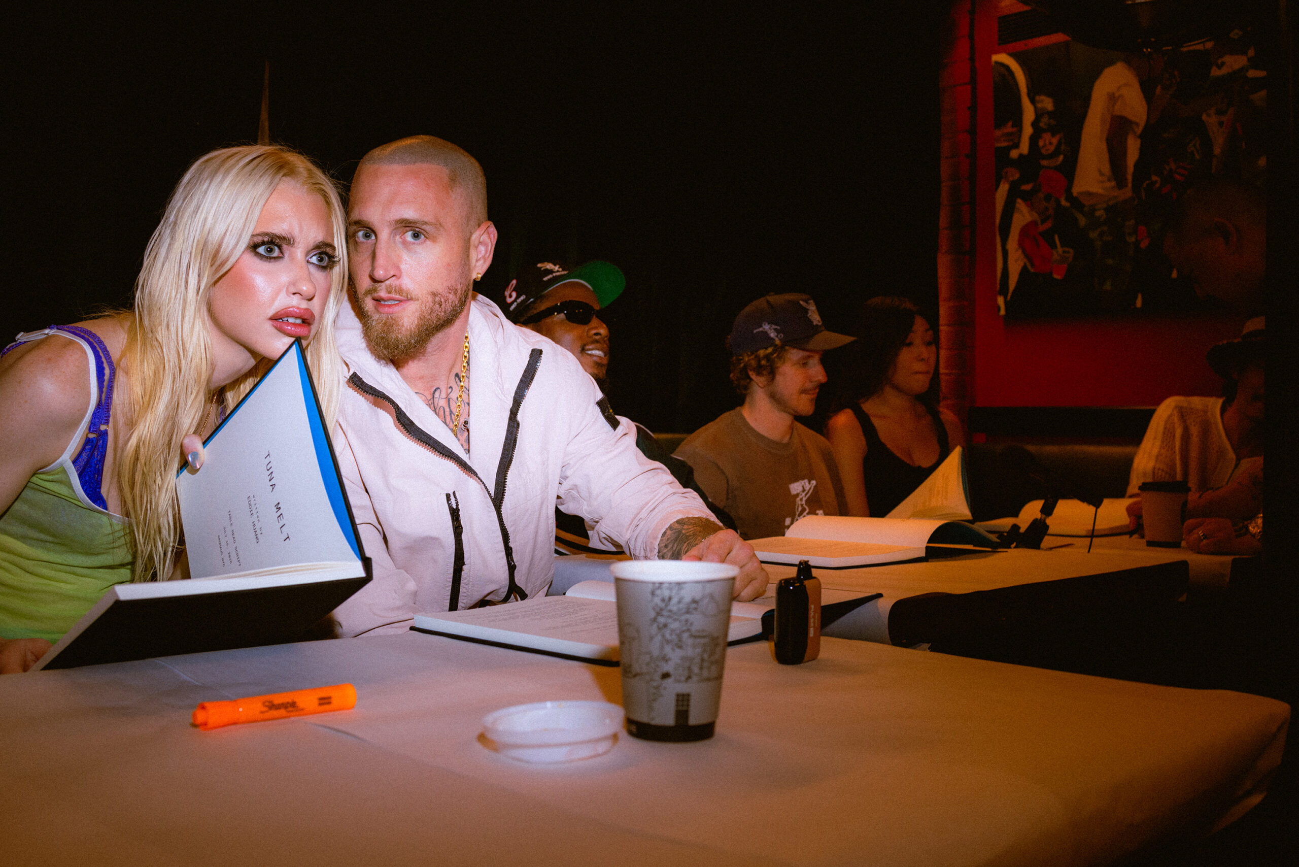 Actors Chloe Cherry and Chet Hanks at chef, filmmaker, and author Eddie Huang's table read for his new movie Tuna Melt at his restaurant Baohaus.