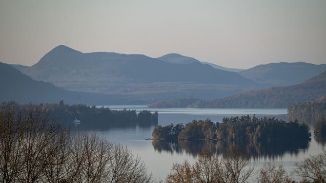 NEWPORT, VERMONT - NOVEMBER 8: The sun sets on Lake Memphremagog, which stands the United States and Canadian borders on November 8, 2021.