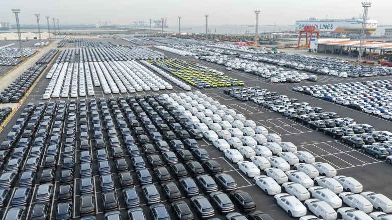Chinese-made vehicles including BYD cars (L) wait to be transshipped for export at a port in Suzhou, in China's eastern Jiangsu province on April 27, 2026.