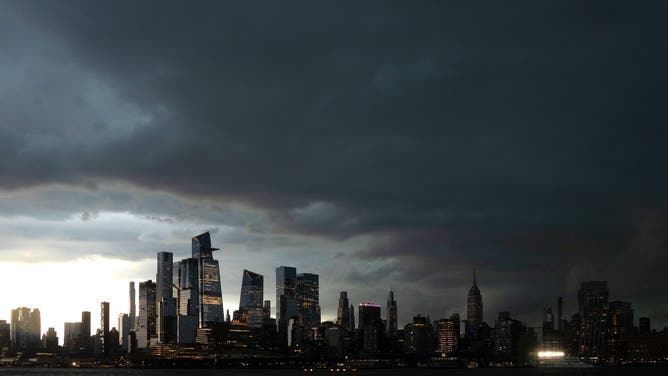 HOBOKEN, NJ - MAY 20: Storm clouds begin to move over the skyline of midtown Manhattan and the Empire State Building in New York City on May 20, 2026, as seen from Hoboken, New Jersey.
