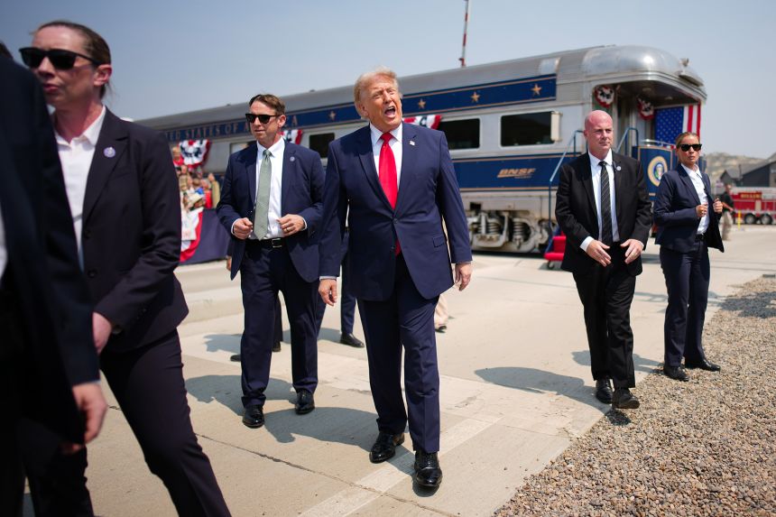 President Donald Trump greets onlookers after arriving in an America250 BSNF Railway train ahead of a dedication ceremony for the Theodore Roosevelt Presidential Library in Medora, North Dakota, on July 1.