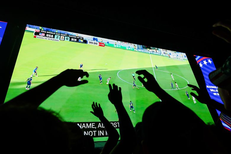 Fans cheer on the United States as they face Bosnia and Herzegovina in a knock out round at the FIFA Fan Zone on the National Mall on July 1 in Washington, DC.