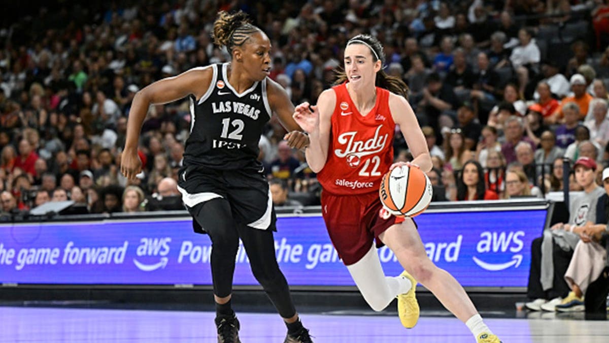 Caitlin Clark drives toward the basket during the Indiana Fever's game against the Las Vegas Aces in Las Vegas.