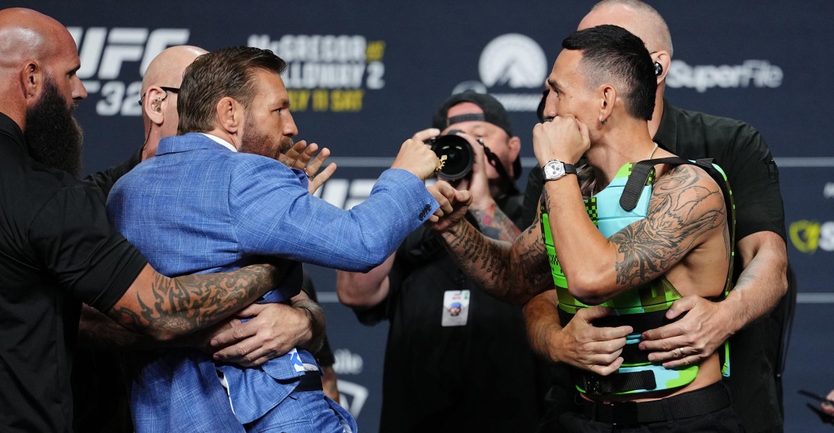 Conor McGregor slams Max Holloway’s glasses to ground in intense UFC 329 staredown