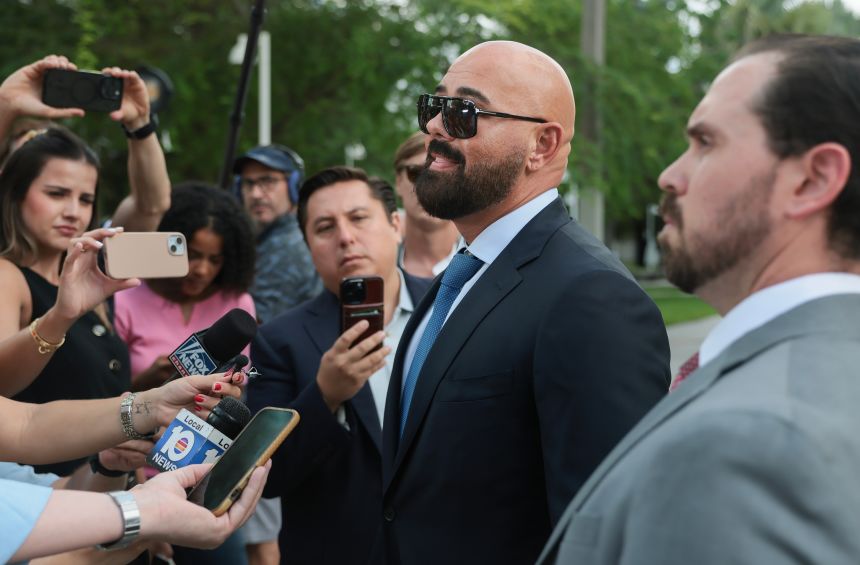 Joseph McBride, left, and Thomas Maniotis, right, co-counsel for Andrew and Tristan Tate, speak to reporters outside of the C. Clyde Atkins United States Courthouse on July 20, 2026, in Miami, Florida. (Photo by Joe Raedle/Getty Images)