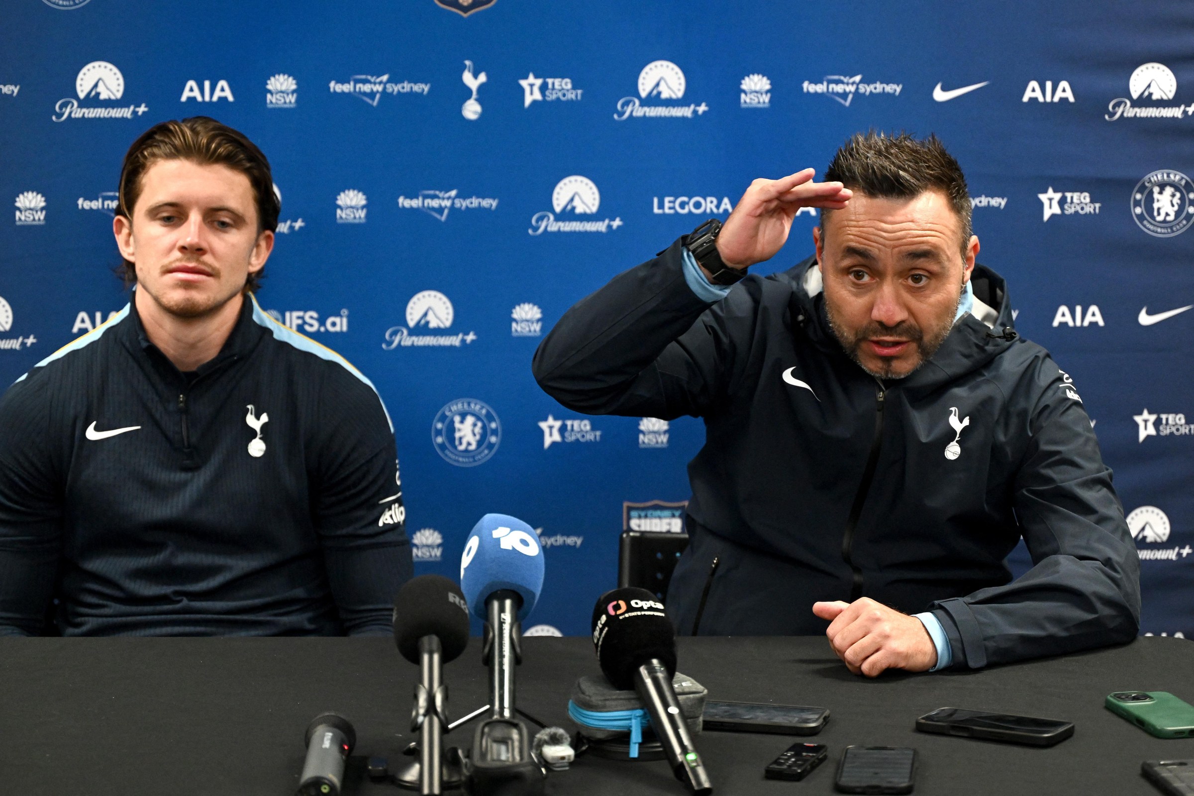 Tottenham Hotspur’s head coach Roberto De Zerbi (R) and player Conor Gallagher attend a press conference after a training session at Allianz Stadium in Sydney on July 31, 2026, ahead of a pre-season friendly against Chelsea. (Photo by SAEED KHAN / AFP via Getty Images) / -- IMAGE RESTRICTED TO EDITORIAL USE - STRICTLY NO COMMERCIAL USE --