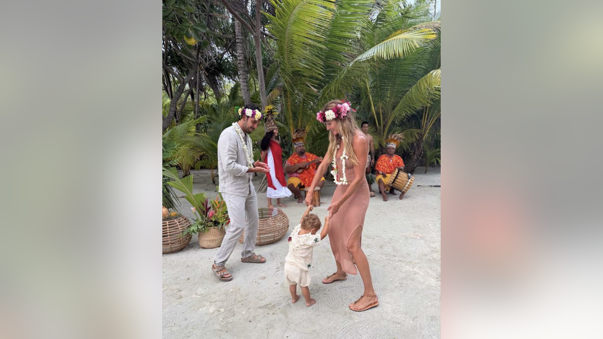 Gisele dancing with son and husband in Tahiti